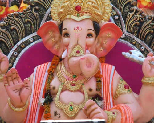 Colorful and detailed statue of Lord Ganesha, embodying Hindu religious art.
